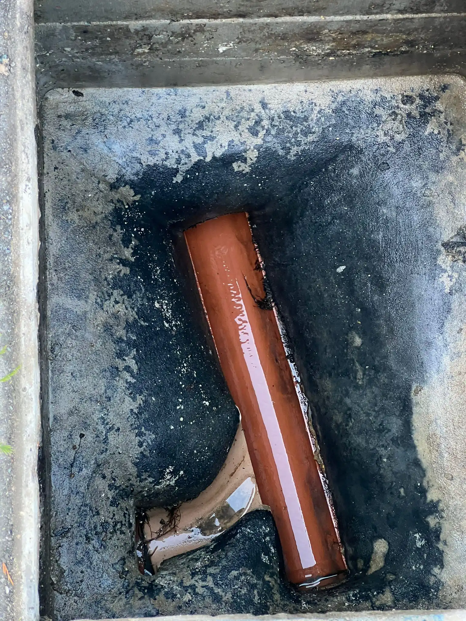 New clay pipe installation in a domestic manhole — professional no-dig drain repair by Drainblock Services in Cornwall towns like Wadebridge, Camborne, and Fowey.