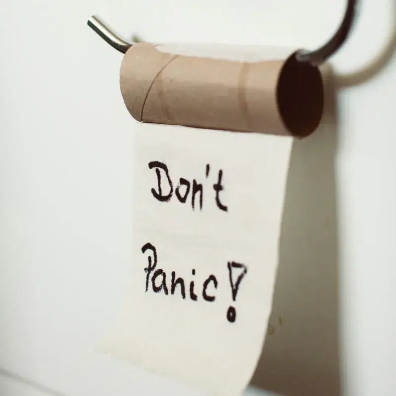 Empty toilet roll with handwritten message “Don’t Panic!” — a humorous image symbolising blocked toilet emergencies in homes across Plymouth and Cornwall.