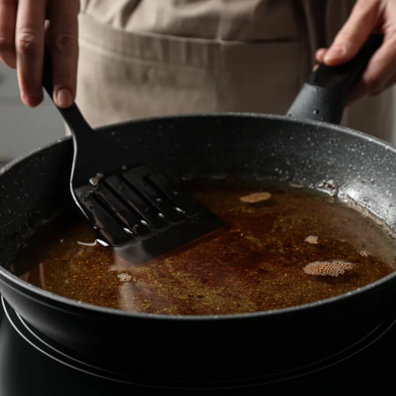 Cooking oil left in a frying pan after use — a leading cause of fatbergs when poured down kitchen sinks in Plymouth households.