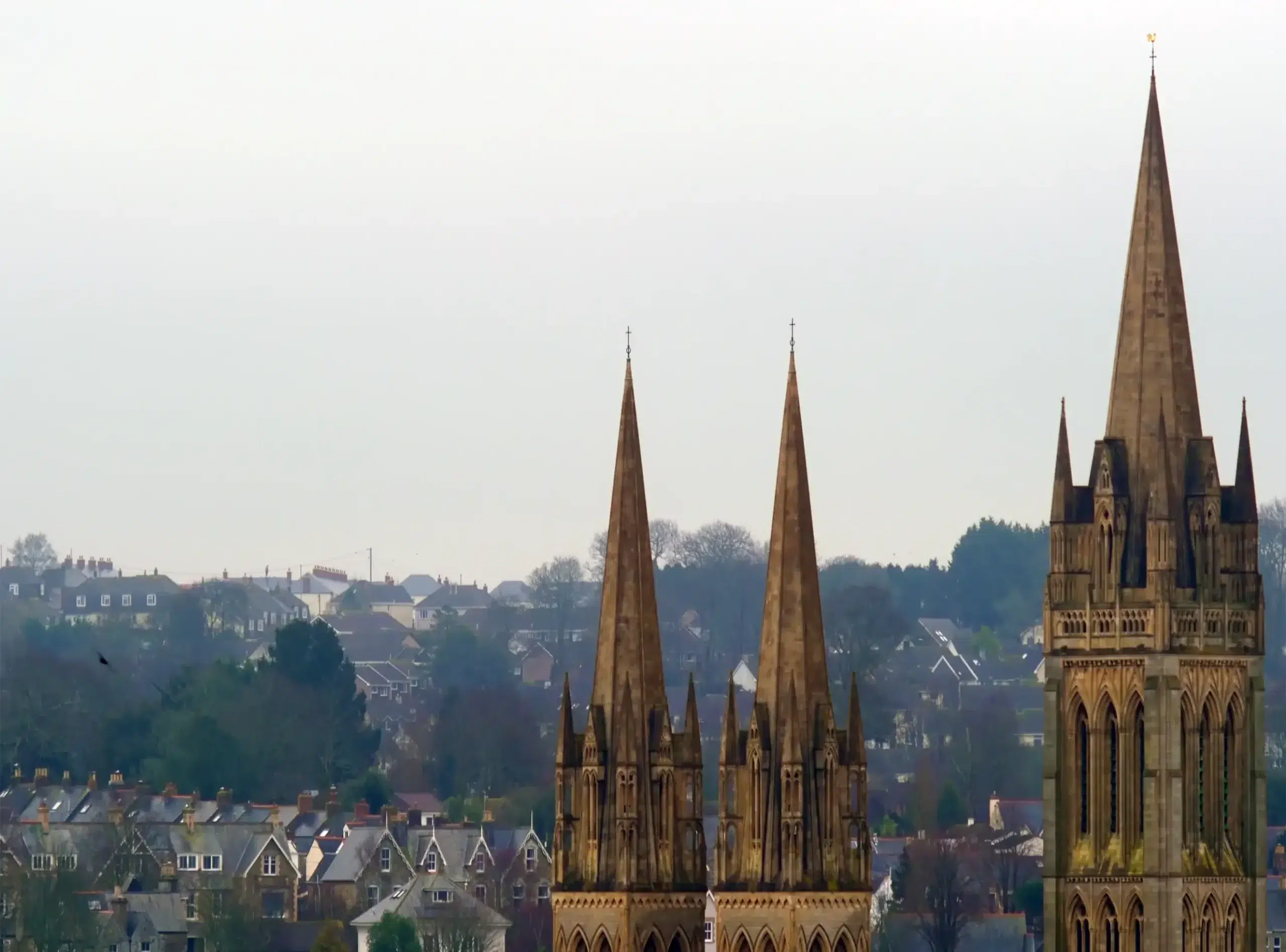 View of Truro Cathedral’s towers rising above residential rooftops in Cornwall’s only city — a region served by Drainblock Services.