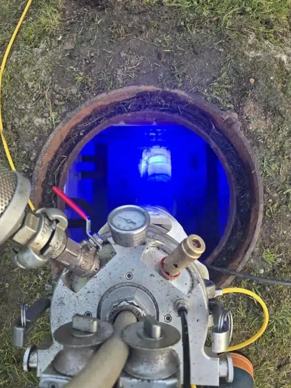 Resin patch curing inside a drain using specialised equipment during a pipe repair by Drainblock Services.